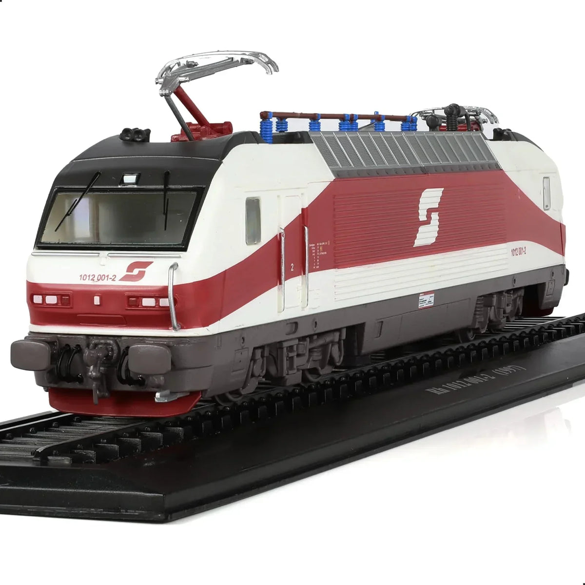 1/87 scale model of a red and white 1997 Kh 1012 locomotive on a track base