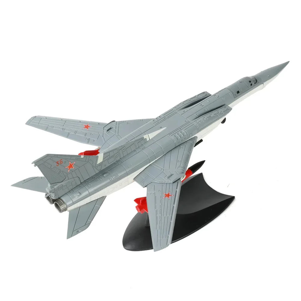 Detailed scale model of a grey military fighter jet with red star markings on a black display stand