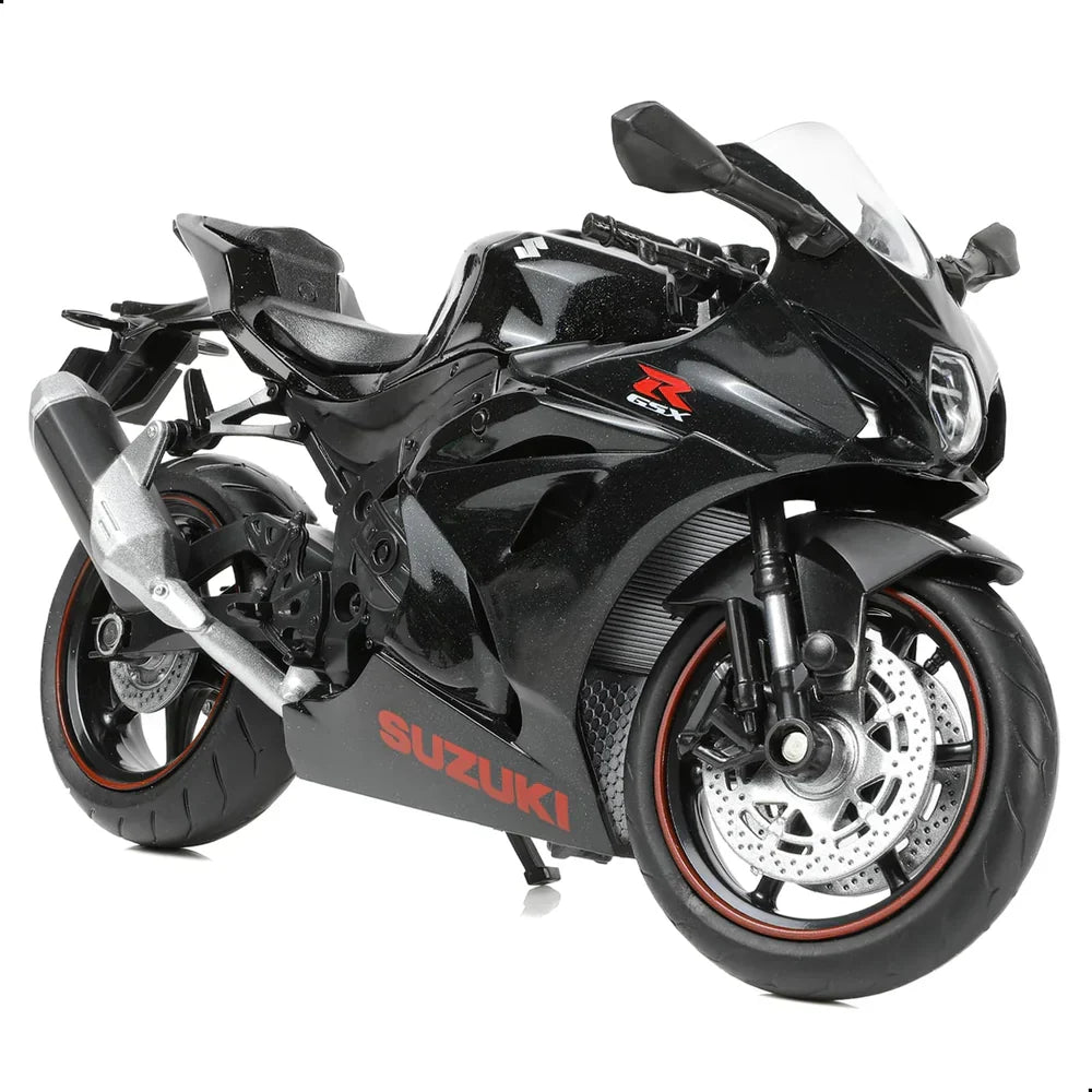 Black 1:12 scale Suzuki GSX-R1000R diecast motorcycle model with red rim accents.