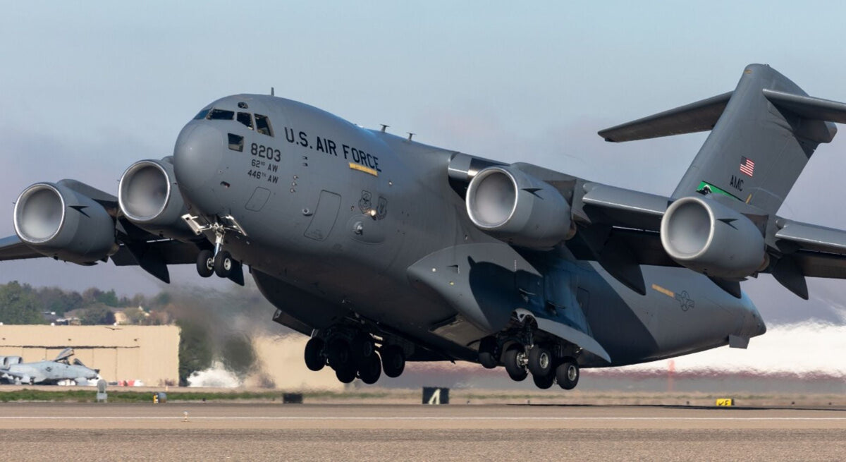 U.S. Air Force C-17 Globemaster III heavy transport aircraft taking off from a runway