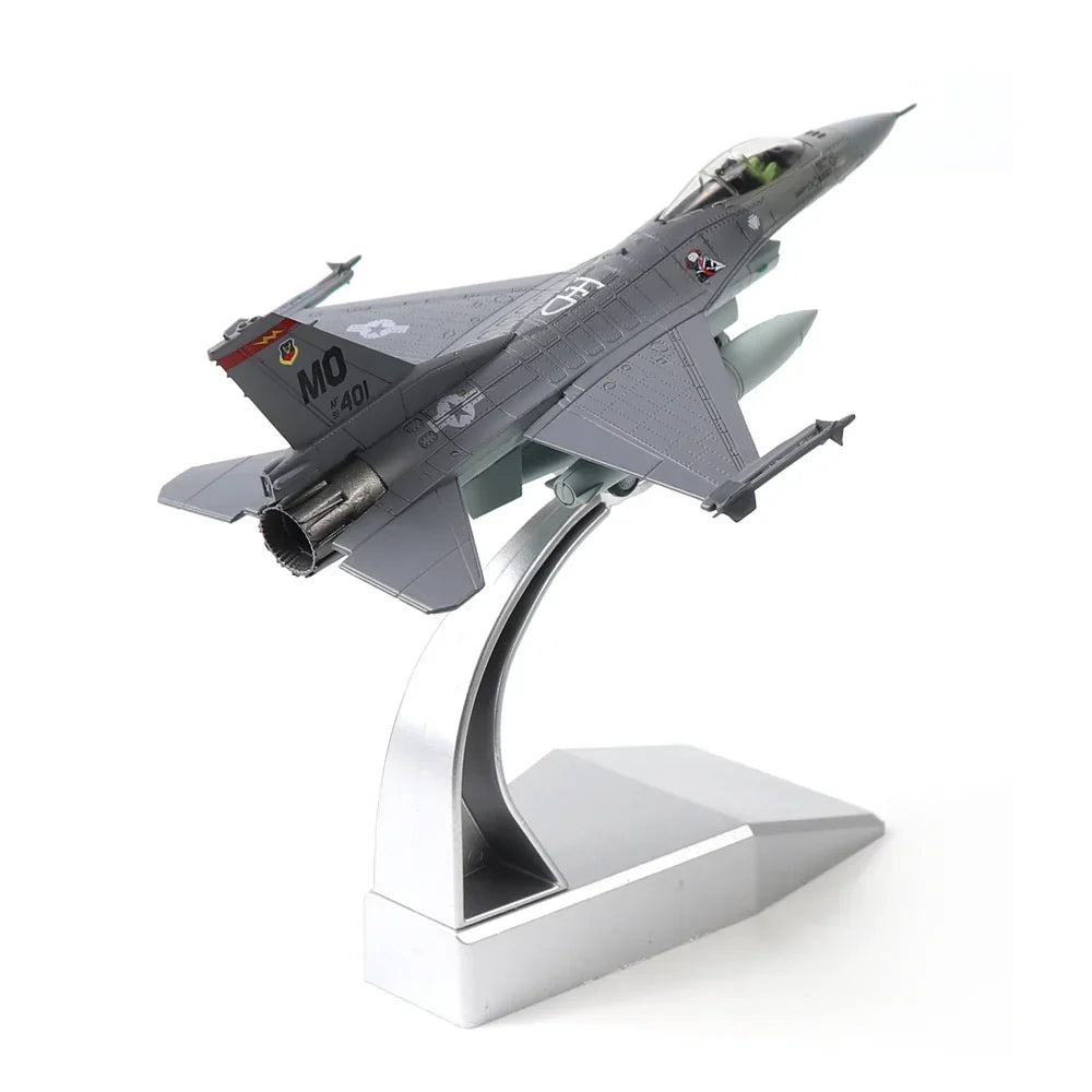 Detailed military jet aircraft model on a silver display stand against a white background