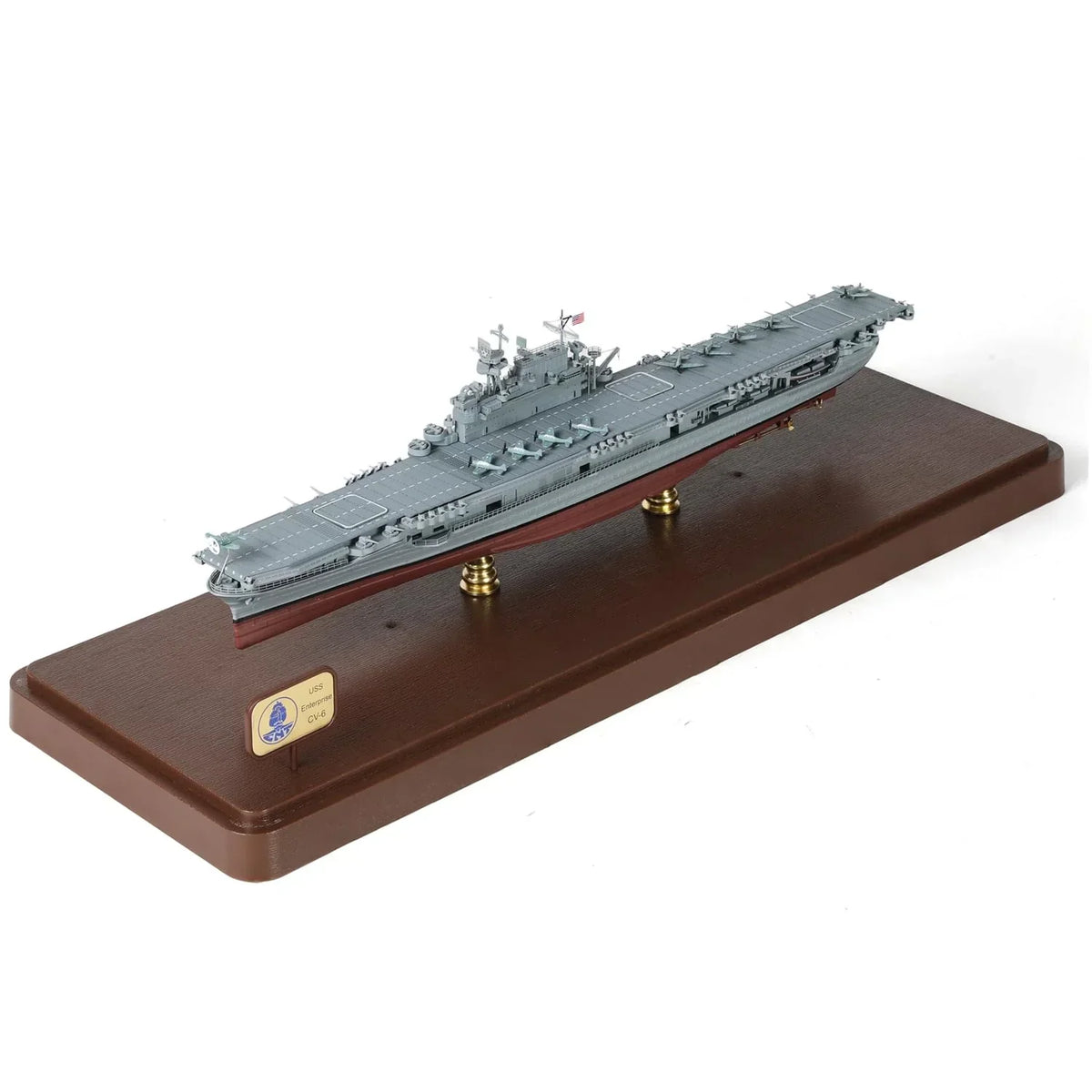 Detailed scale model of the USS Enterprise aircraft carrier on a wooden display stand