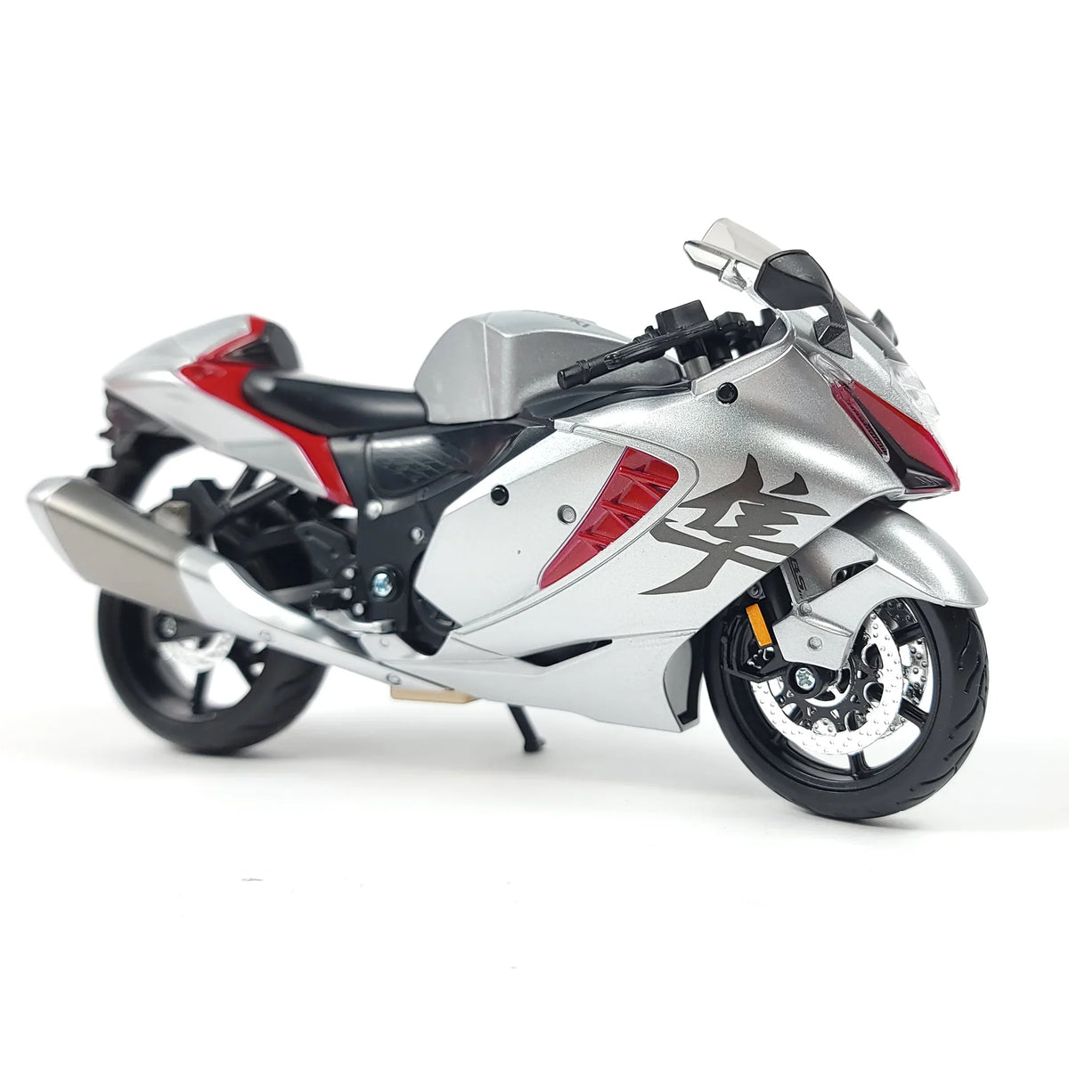 Die-cast Suzuki Hayabusa GSX1300R motorcycle model in silver and red with detailed features.