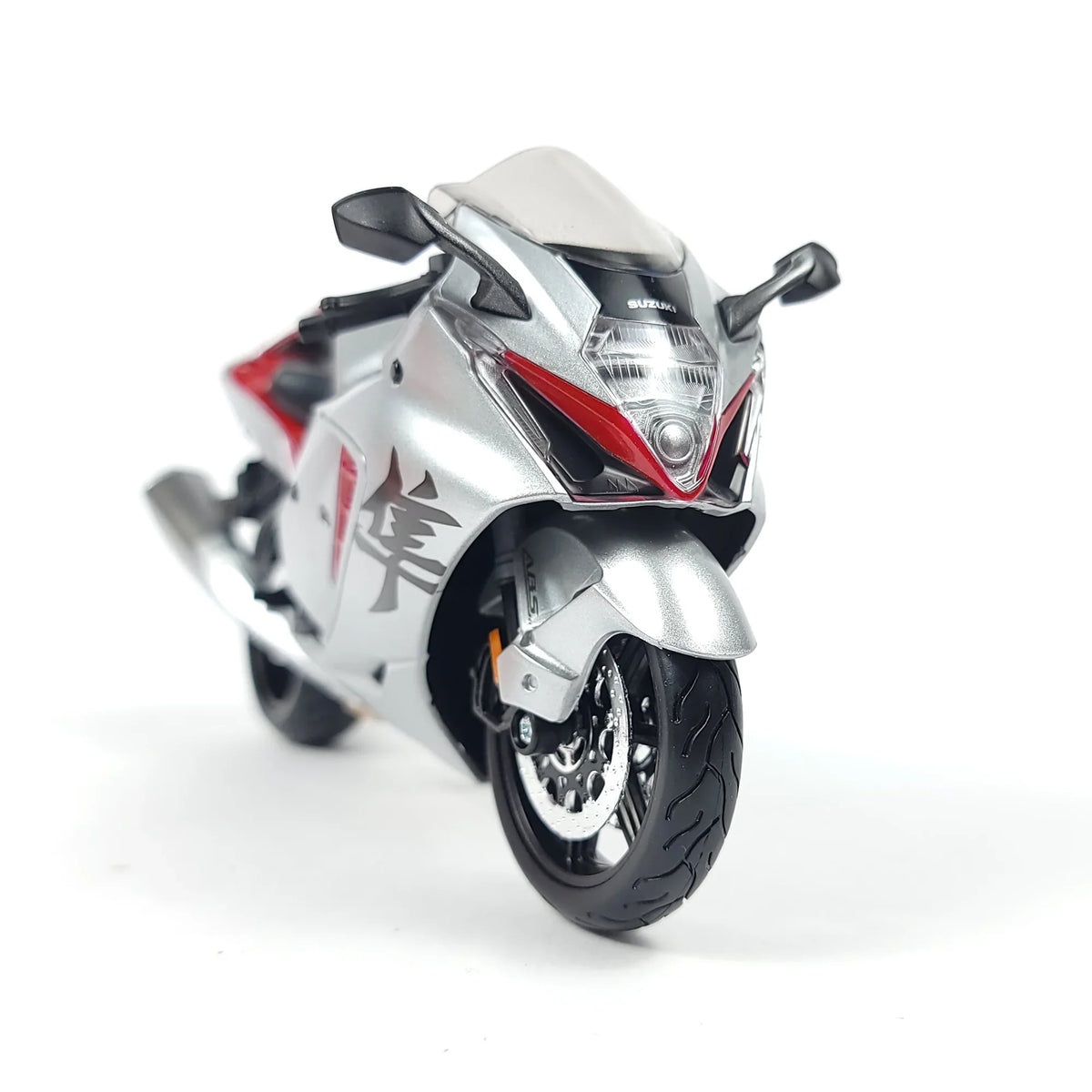 Die-cast Suzuki Hayabusa GSX1300R motorcycle model in silver and red with detailed front view.