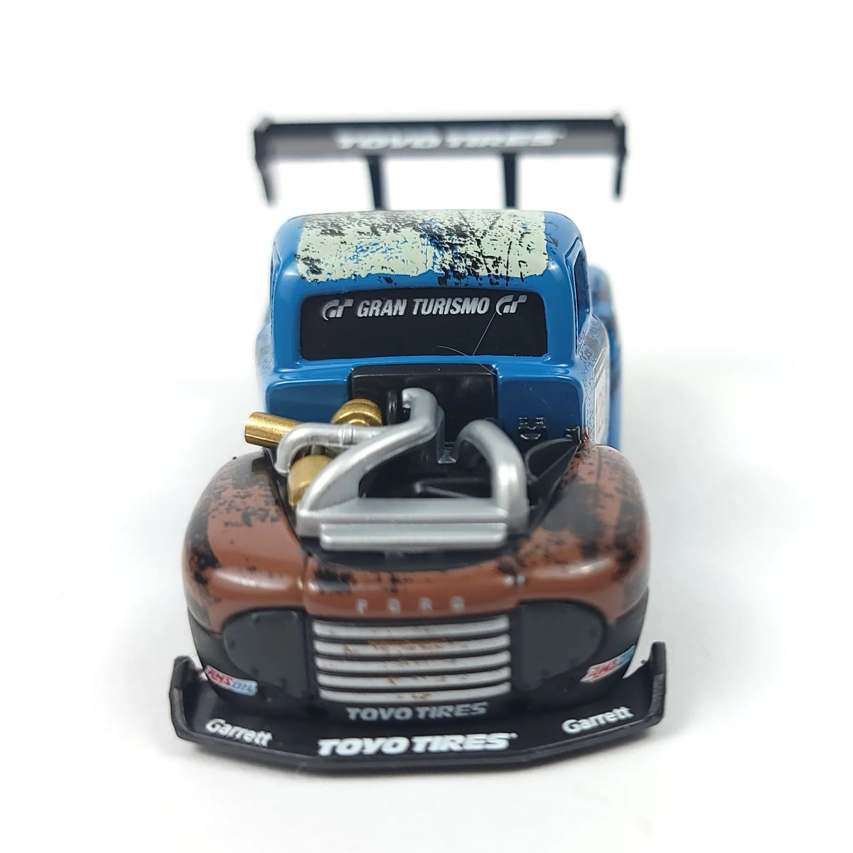 Front view of the 1949 Ford F1 Pickup Truck model showcasing the blue cab and brown hood with visible details.