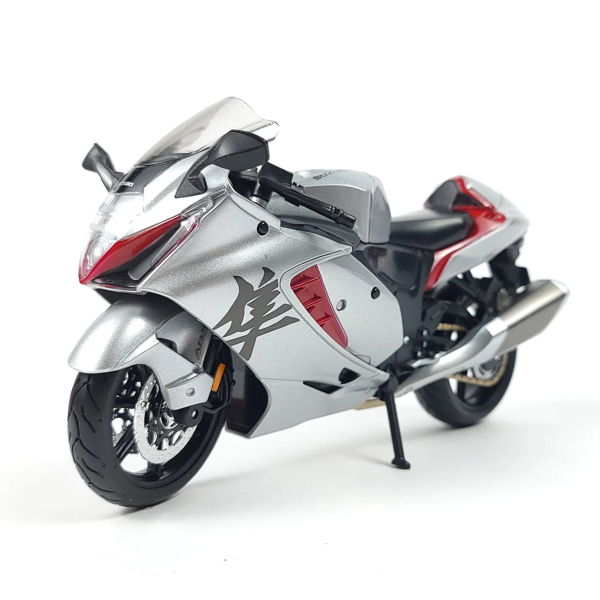 Side view of the die-cast Suzuki Hayabusa GSX1300R motorcycle model showcasing its design and color.