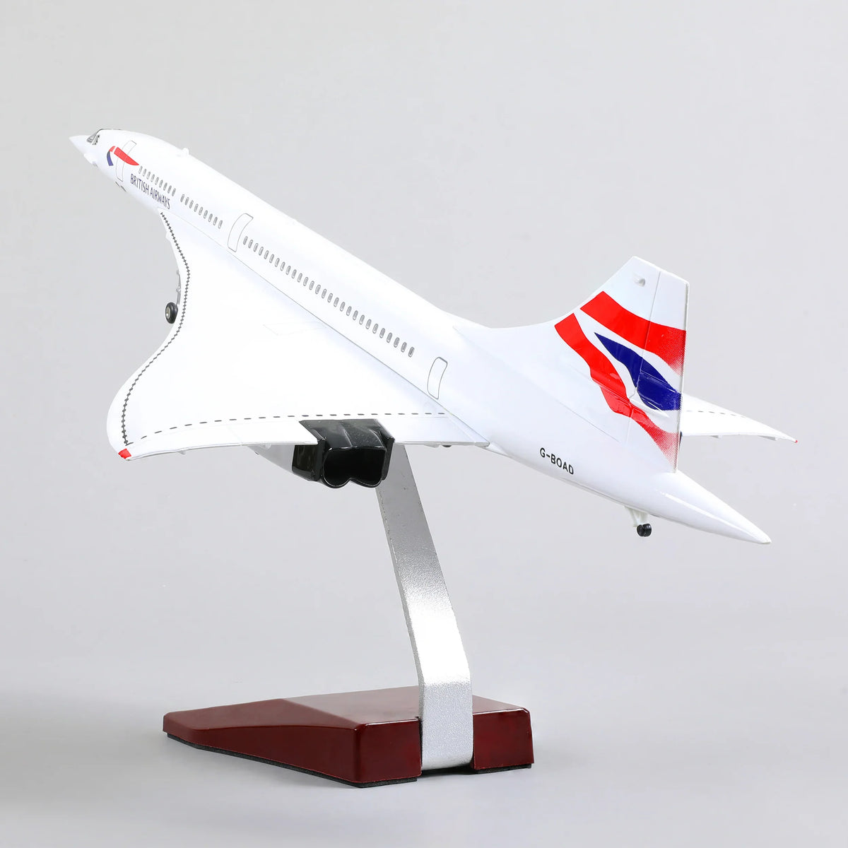 QIYUMOKE Concorde airplane model from below, highlighting the tail design and stand.