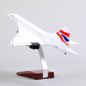 QIYUMOKE Concorde airplane model from below, highlighting the tail design and stand.