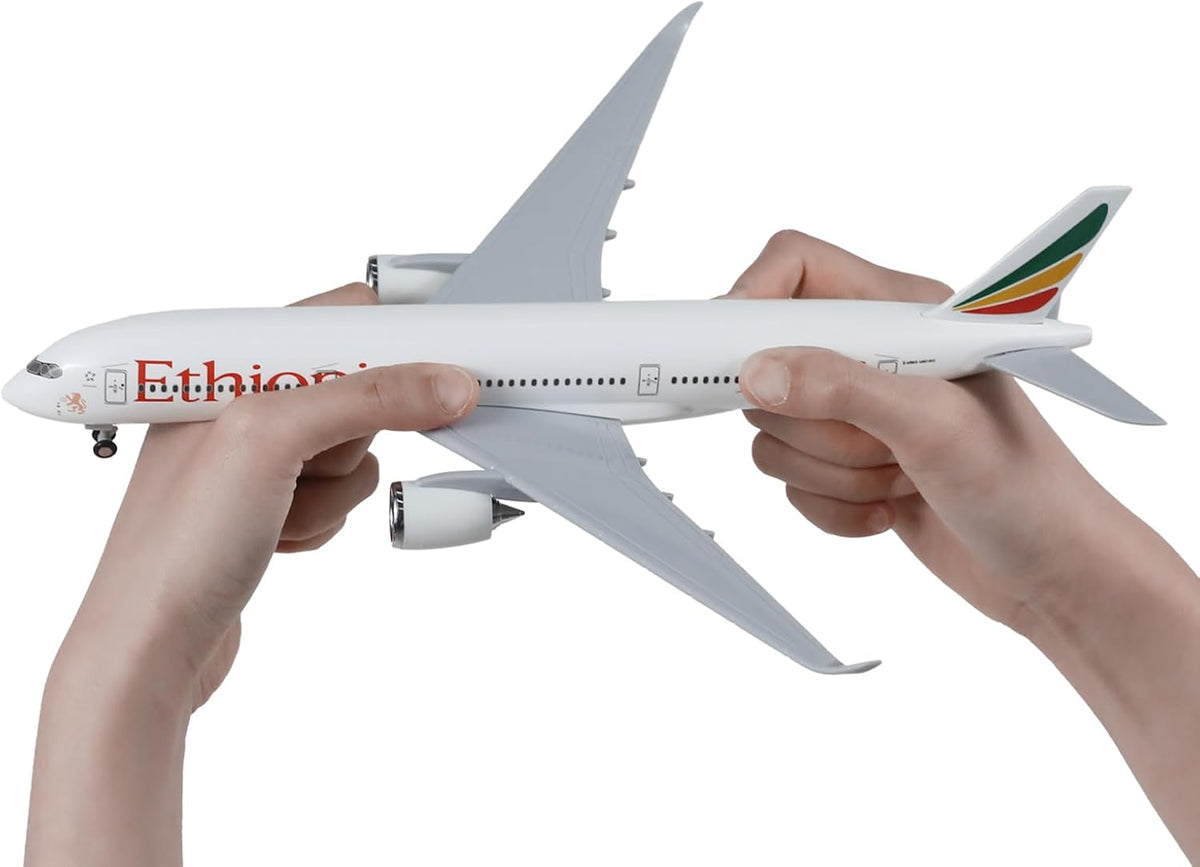 Two hands holding the 1/240 Ethiopian Airbus A350 resin airplane model