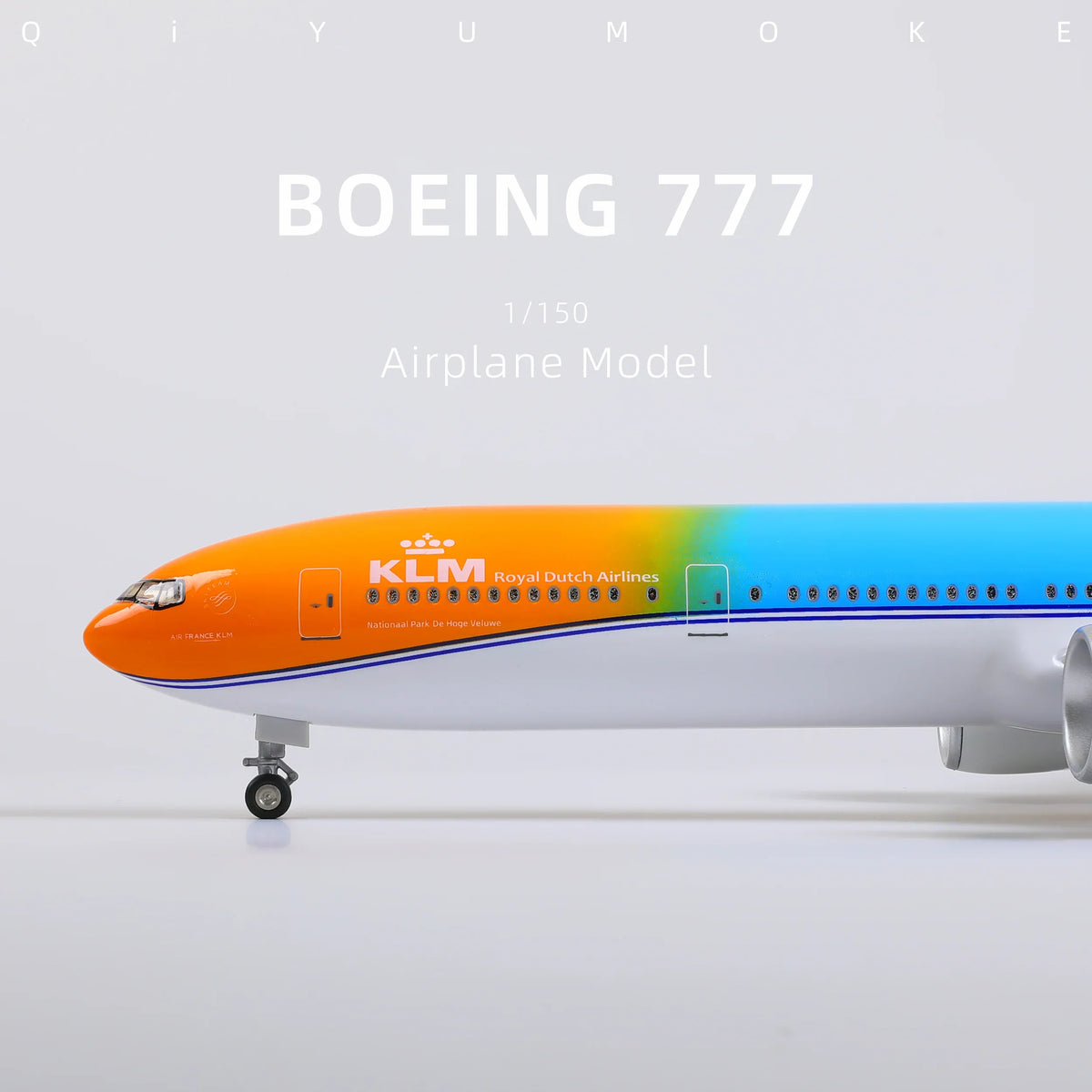 QIYUMOKE Boeing 777-300ER model in orange and blue, side profile view