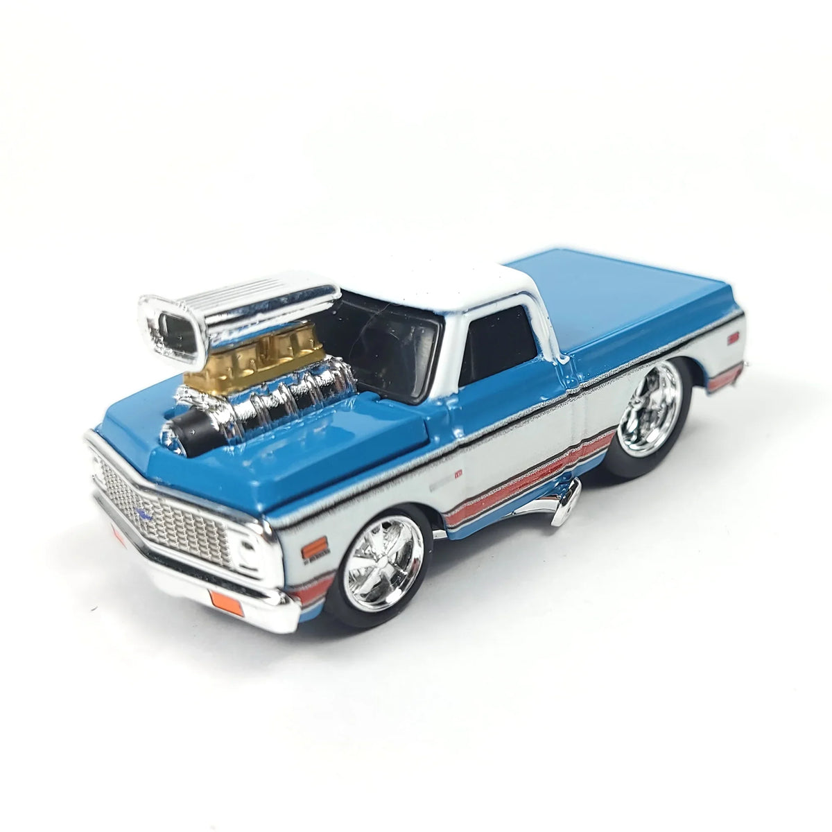Front angle of the die-cast 1972 Chevrolet C10 pickup truck model displaying chrome wheels and engine details.