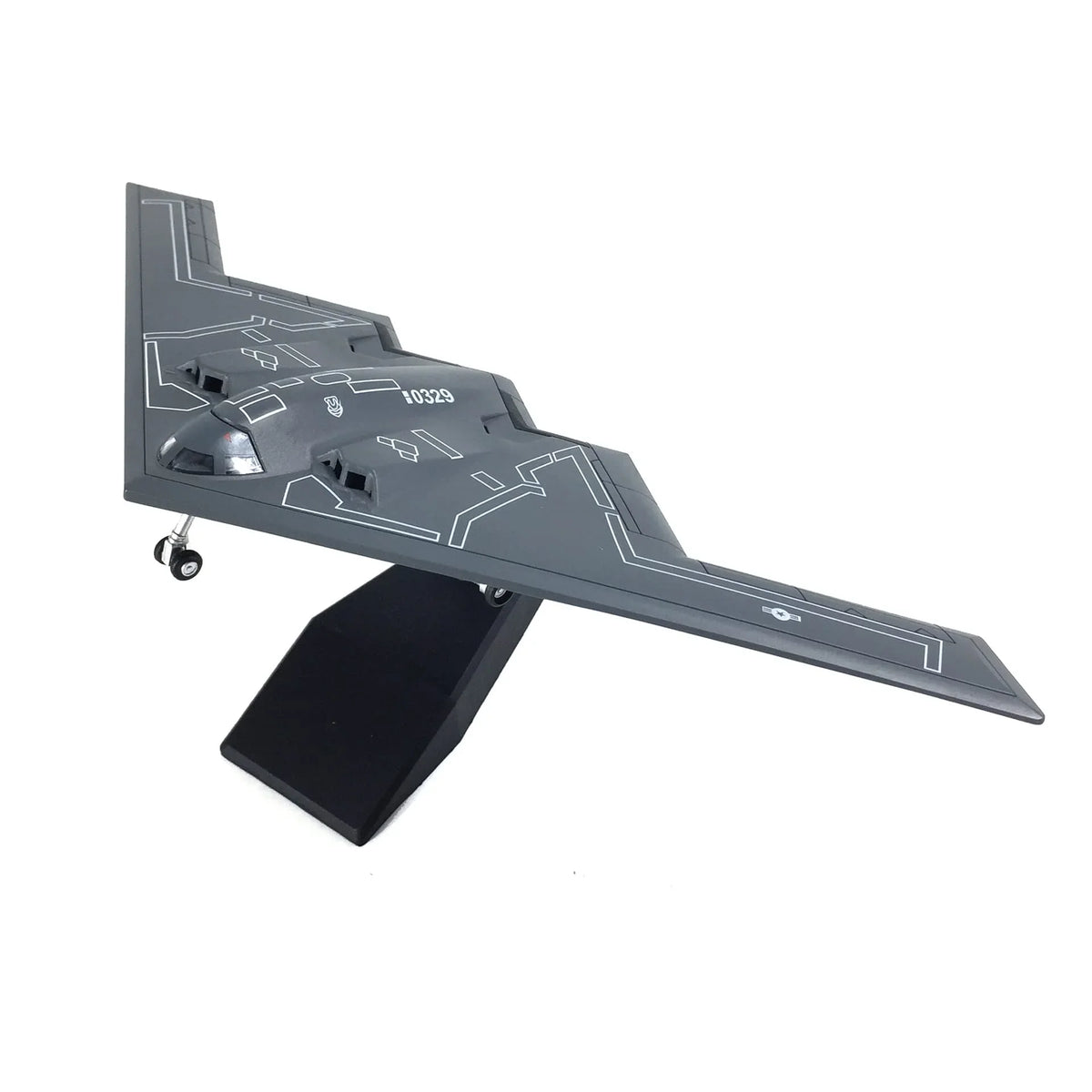NUOTIE Northrop B-2 Spirit diecast model in gray, displayed on a stand, front view
