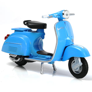 Blue 1/18 scale diecast model of a 2016 Vespa PX moped scooter with black seat and display stand.