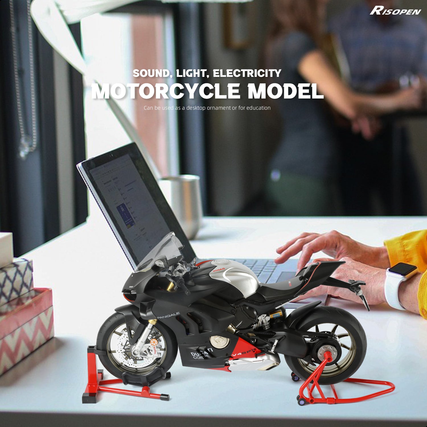 Ducati motorcycle model on a desk next to a laptop, showcasing its use as a decorative item.