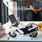 Suzuki Hayabusa motorcycle model in white with blue accents, displayed on a stand next to a laptop.