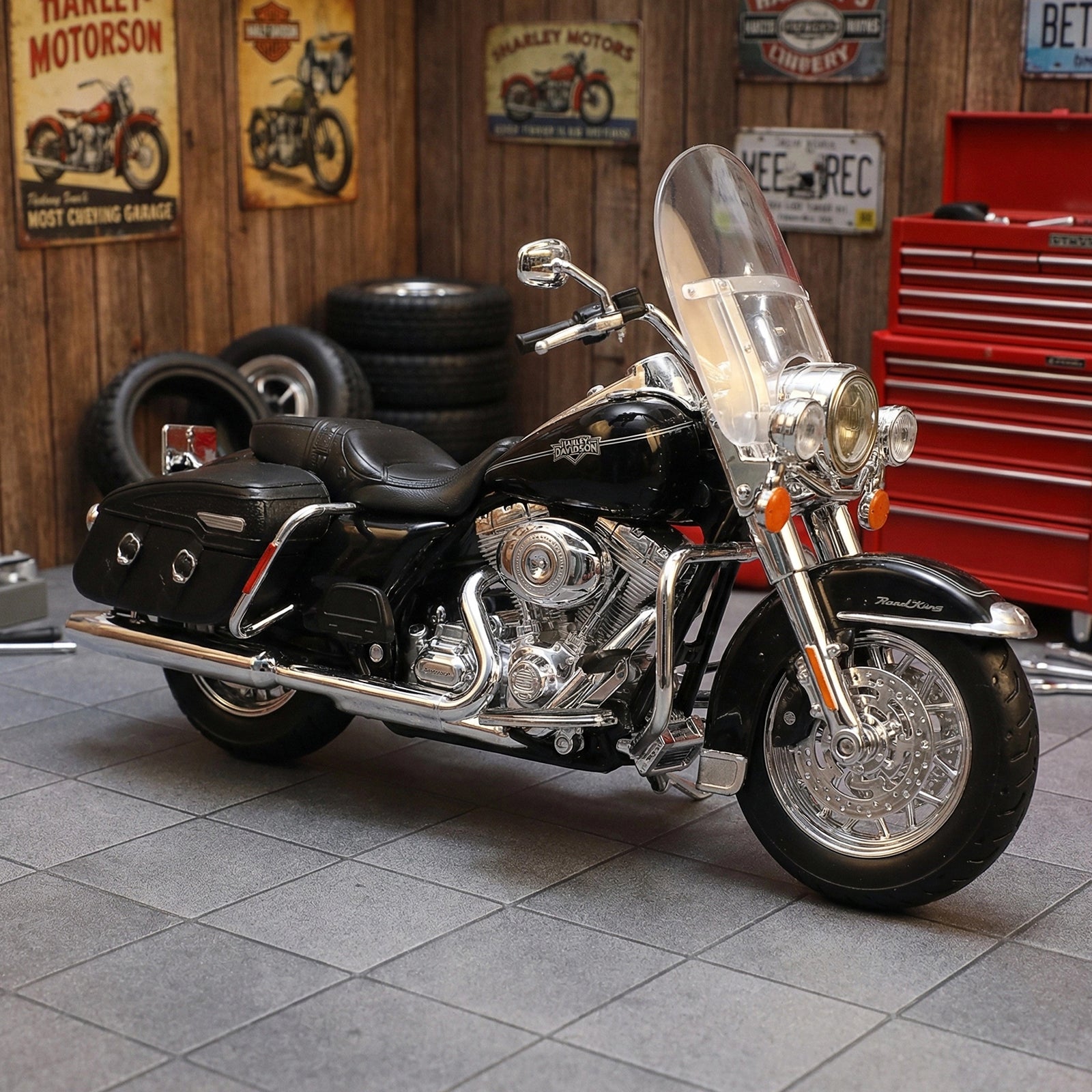 Maisto 2013 Flhrc Road King Classic motorcycle toy in black, front view in garage setting