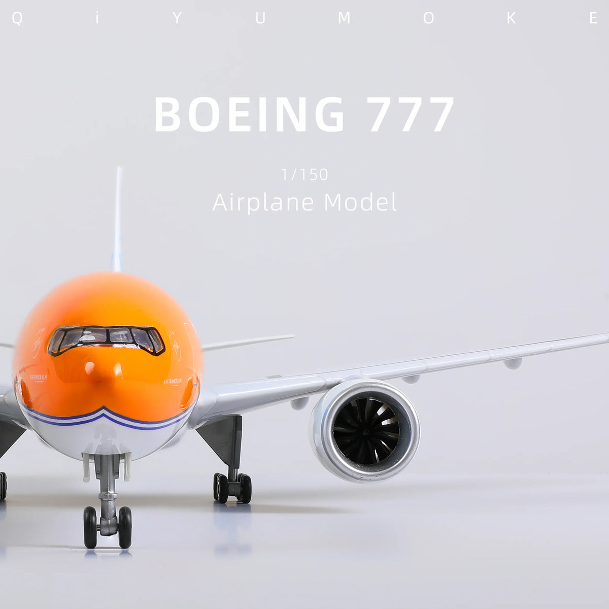 QIYUMOKE Boeing 777-300ER model in orange, front view with detailed nose and engine