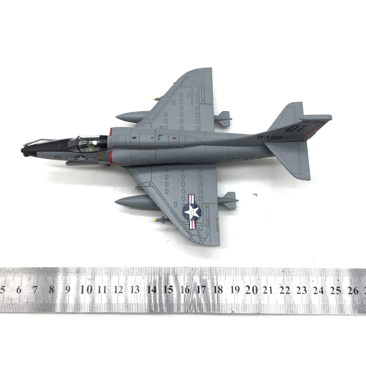 NUOTIE A-4 Skyhawk model in gray with red accents, top view with ruler for scale