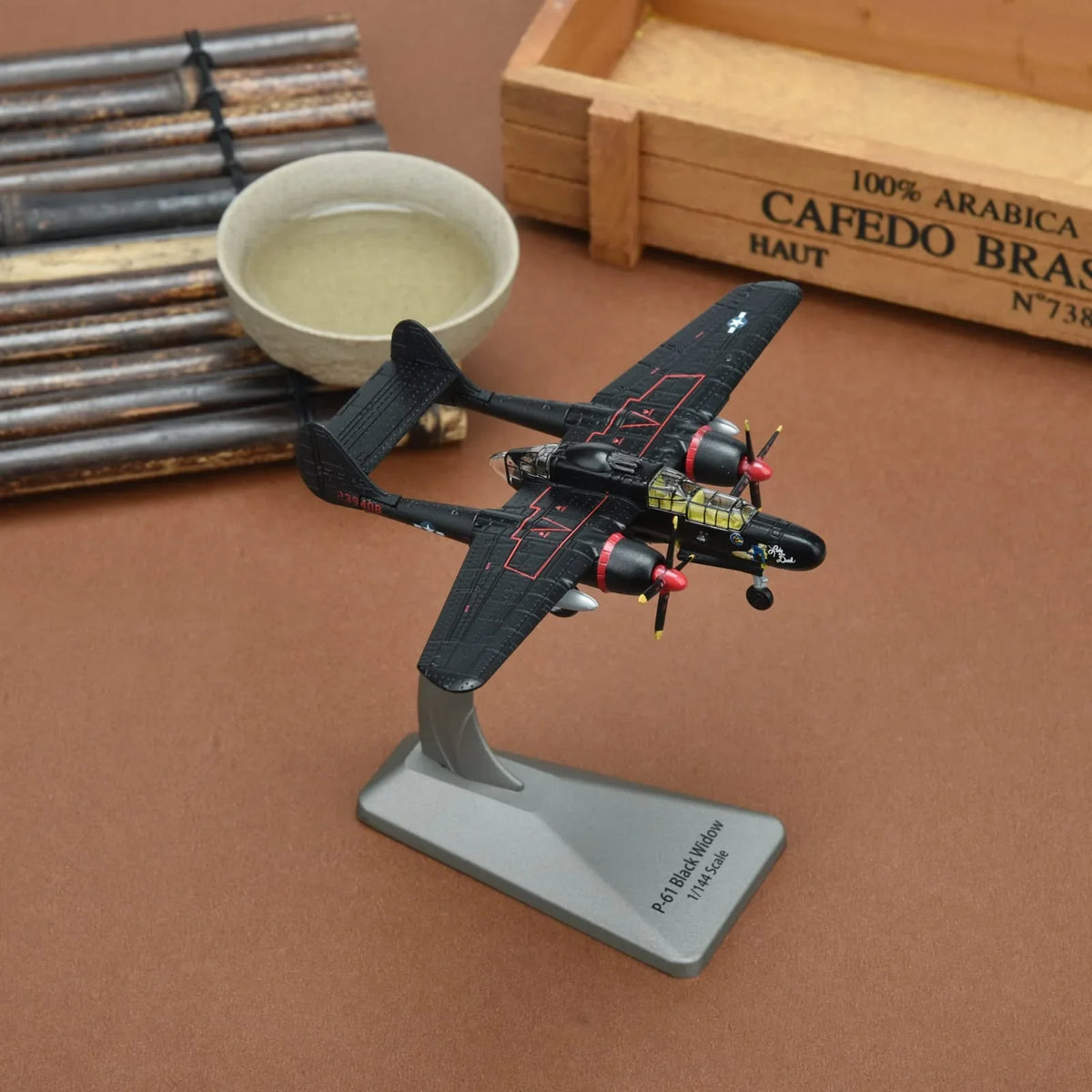 NUOTIE Model 1/144 Scale Northrop P-61B Black Widow aircraft in black, positioned on a stand.