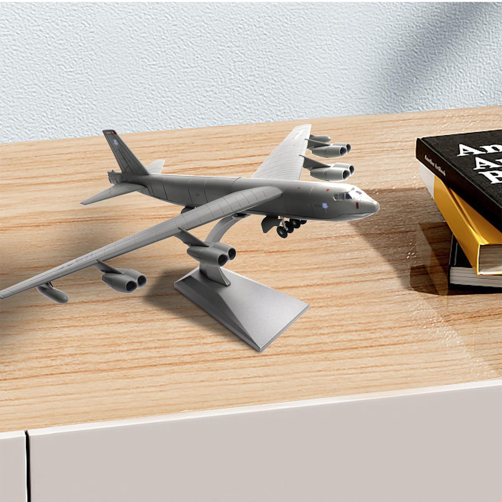 NUOTIE Boeing B-52 Stratofortress model displayed on a table with books
