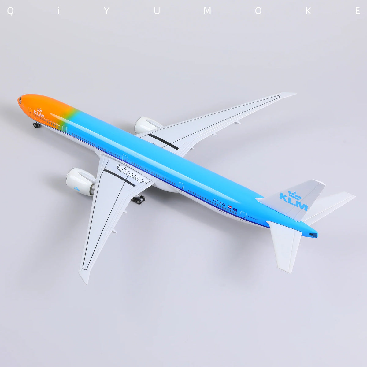 QIYUMOKE Boeing 777-300ER model in orange and blue colors, top view
