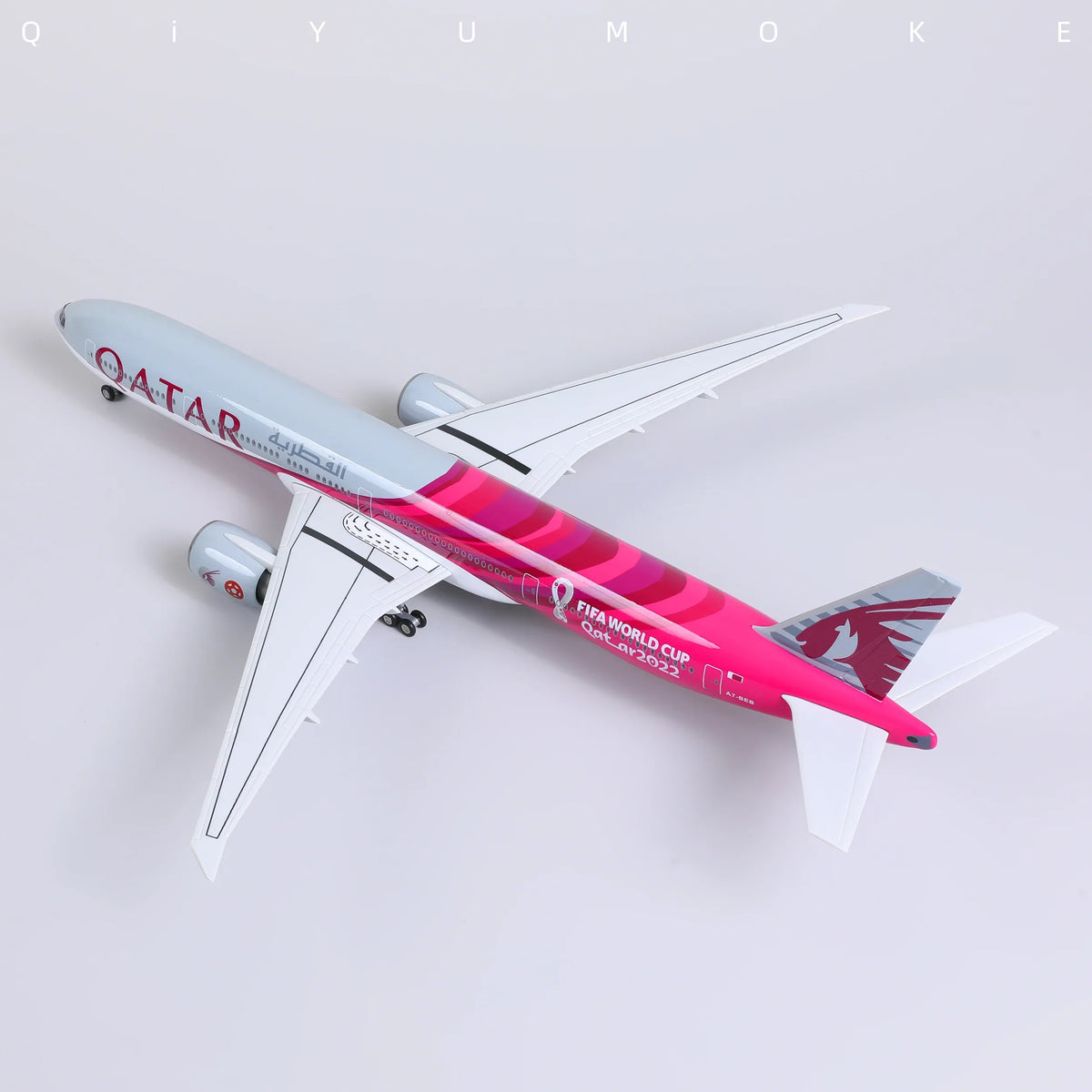 QIYUMOKE Boeing 777-300ER Qatar Airways diecast model in commemorative livery, top view