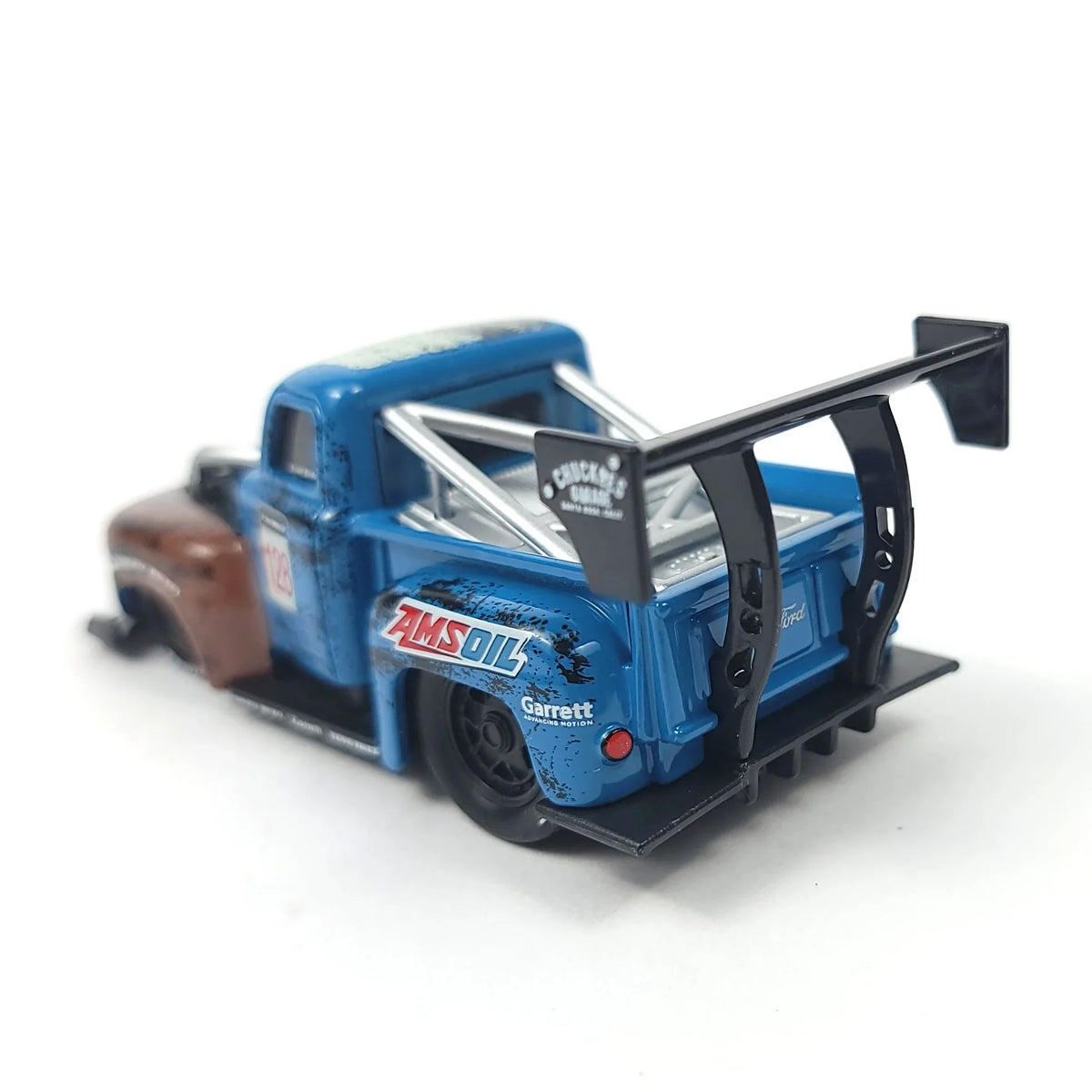 Rear view of the 1949 Ford F1 pickup truck model showcasing the large rear wing and decals.
