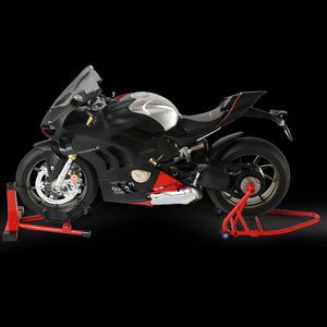 Side view of Ducati Panigale V4 SP2 motorcycle model in black and silver, displayed on a stand against a black background.