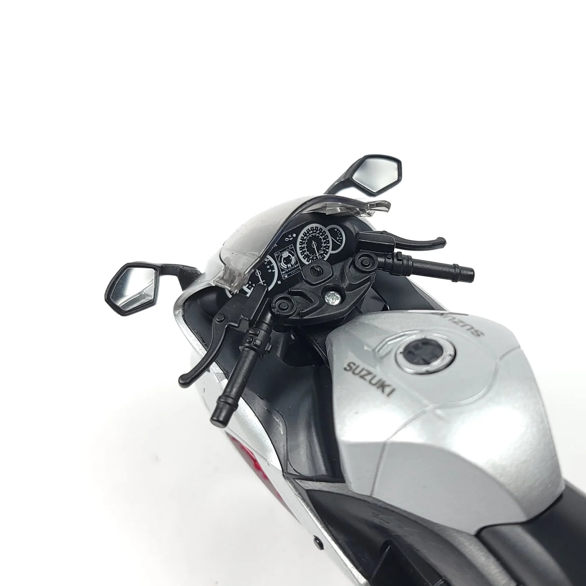 Close-up of the motorcycle's handlebars and dashboard, featuring detailed gauges and controls.