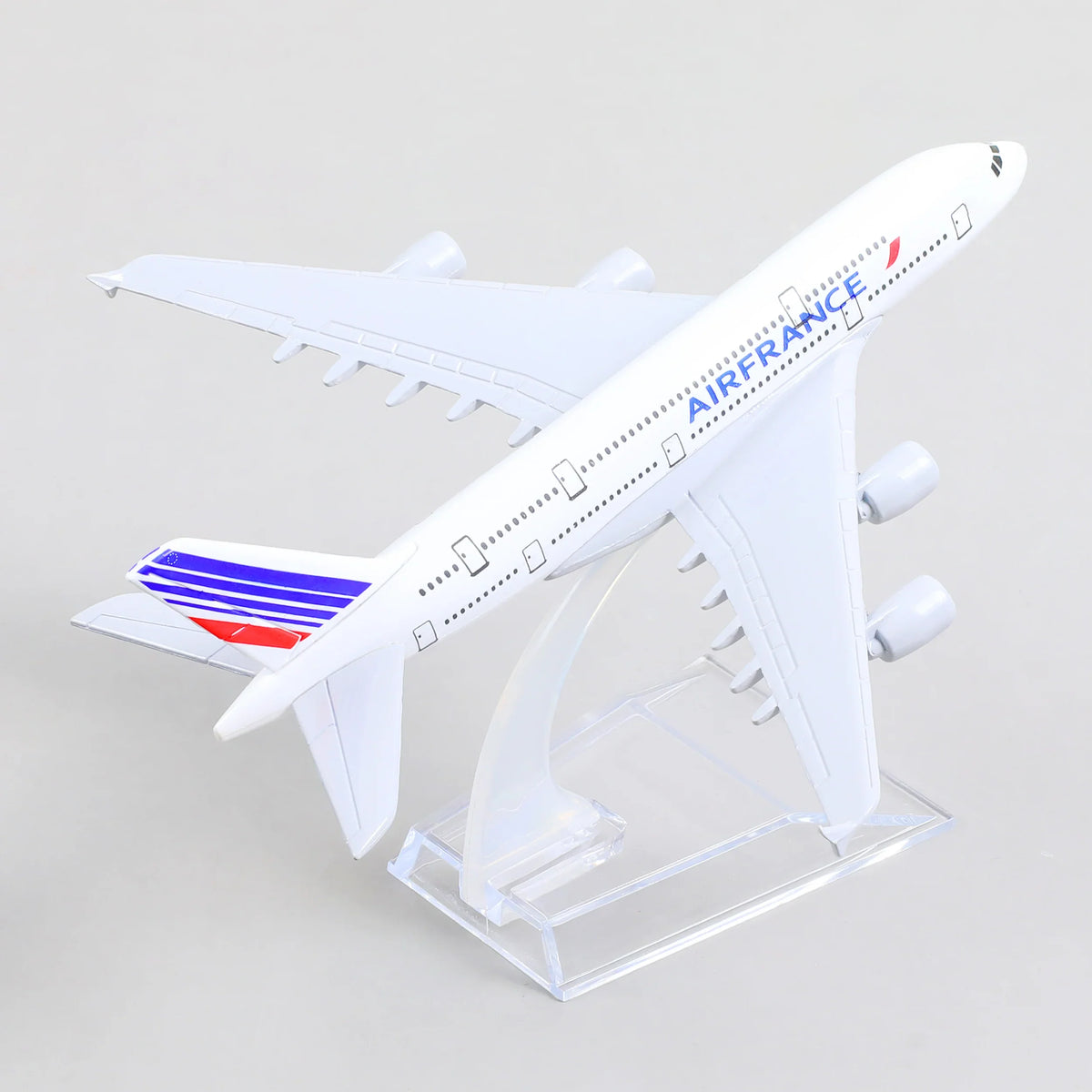 QIYUMOKE Airbus A380 Air France model side view with blue and red stripes on display stand
