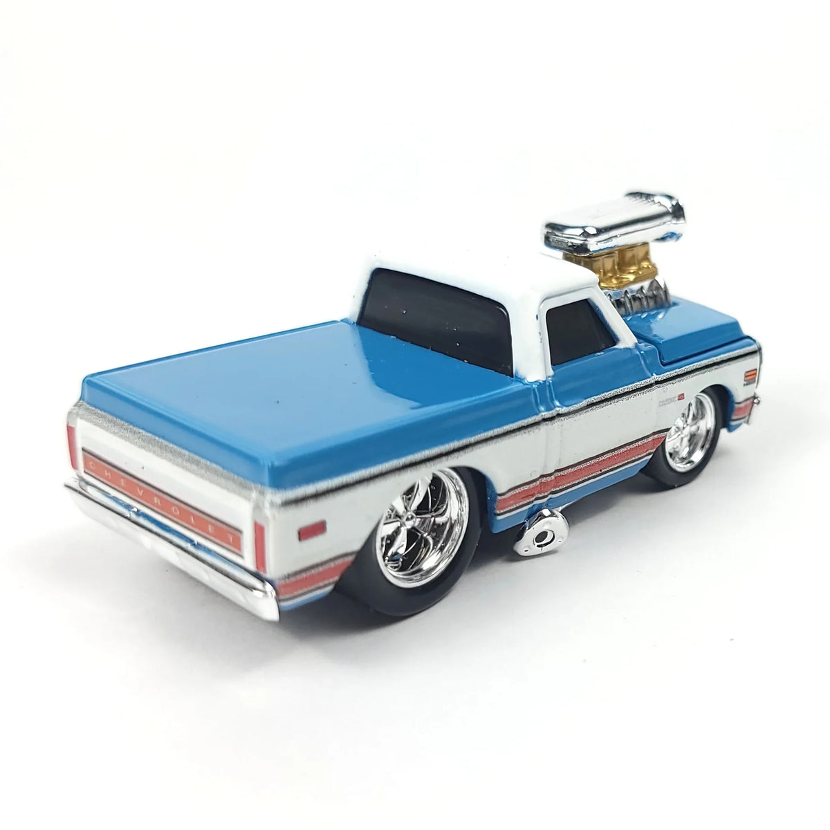 Rear view of a blue and white 1972 Chevrolet C10 pickup truck scale model highlighting the tailgate and wheels.