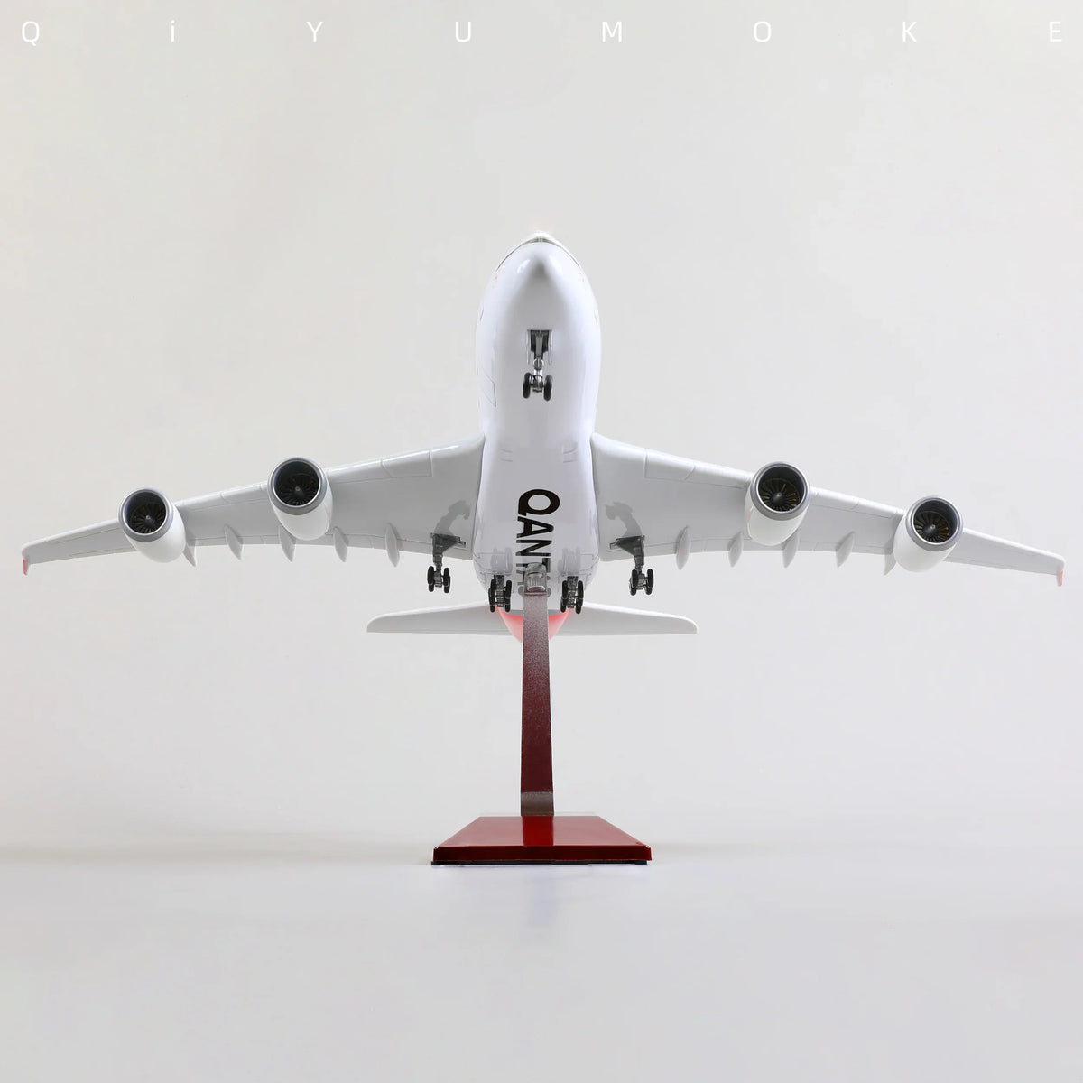 QIYUMOKE Airbus A380 airplane model in white with stand, front view showcasing engines