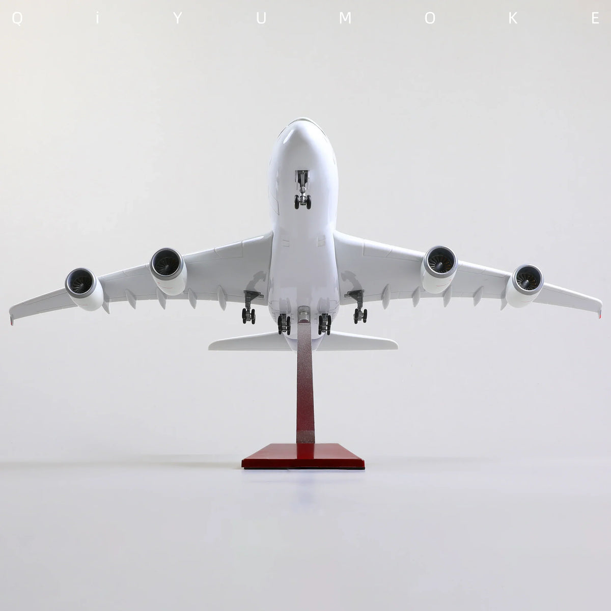 QIYUMOKE Airbus A380 diecast model in test livery, front view on display stand