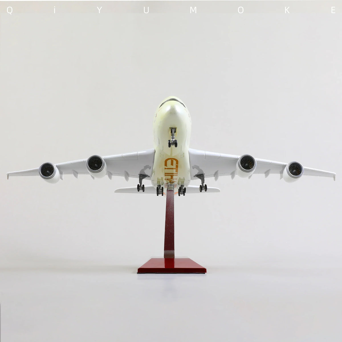 QIYUMOKE Airbus A380 Etihad Airways airplane model viewed from the front on a stand