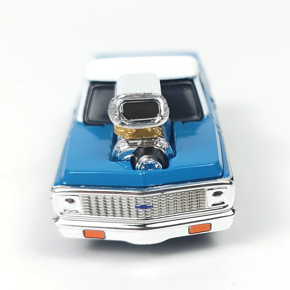Front view of a blue 1972 Chevrolet C10 pickup truck scale model with a chrome supercharger.