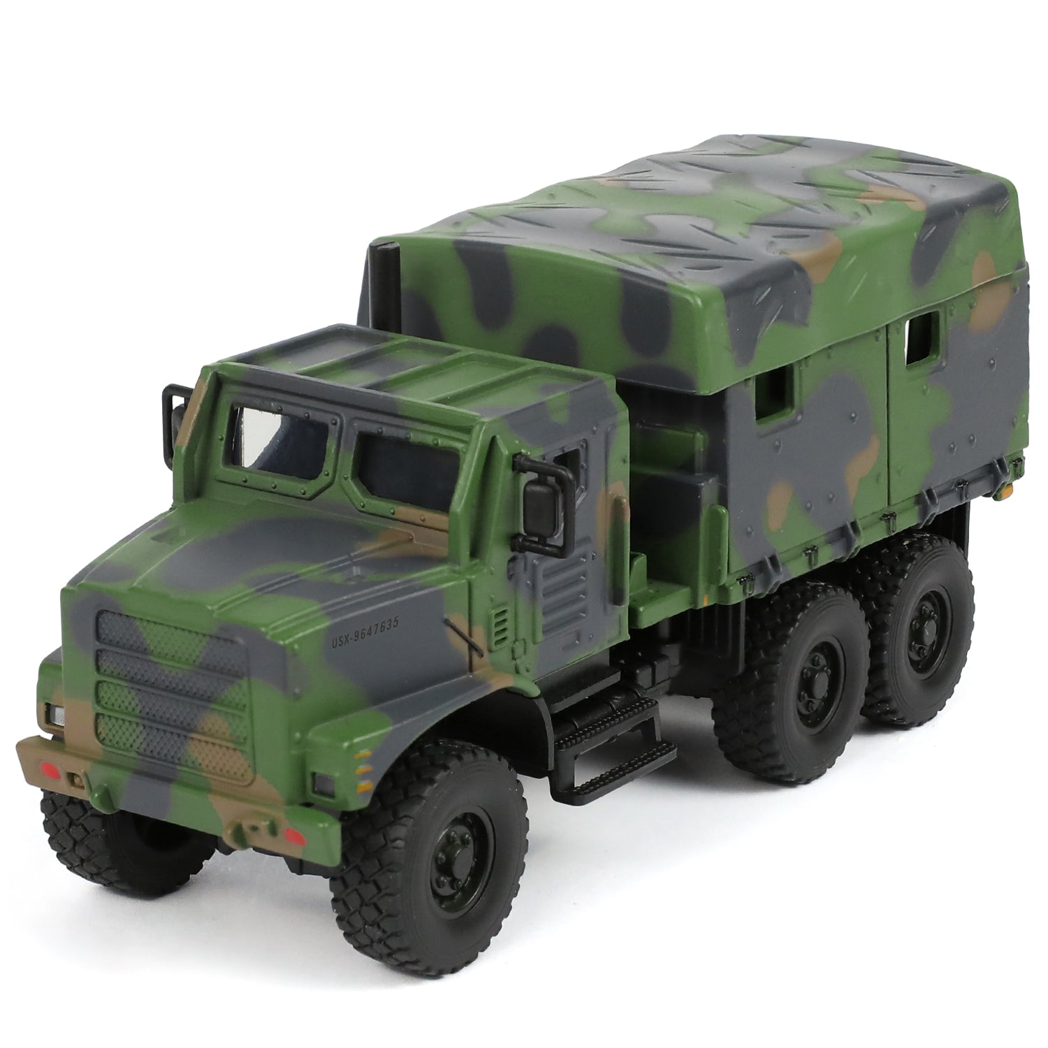 1:64 scale model of a USMC MTVR MK23 military truck in green camouflage with a cargo cover.