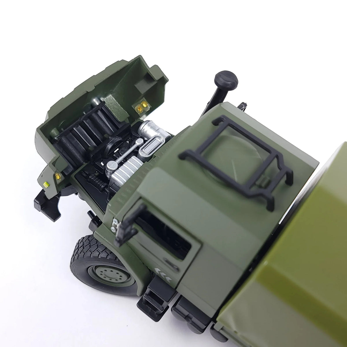 Top view of a 1:36 die-cast armored military truck model with an open hood showing the engine details.