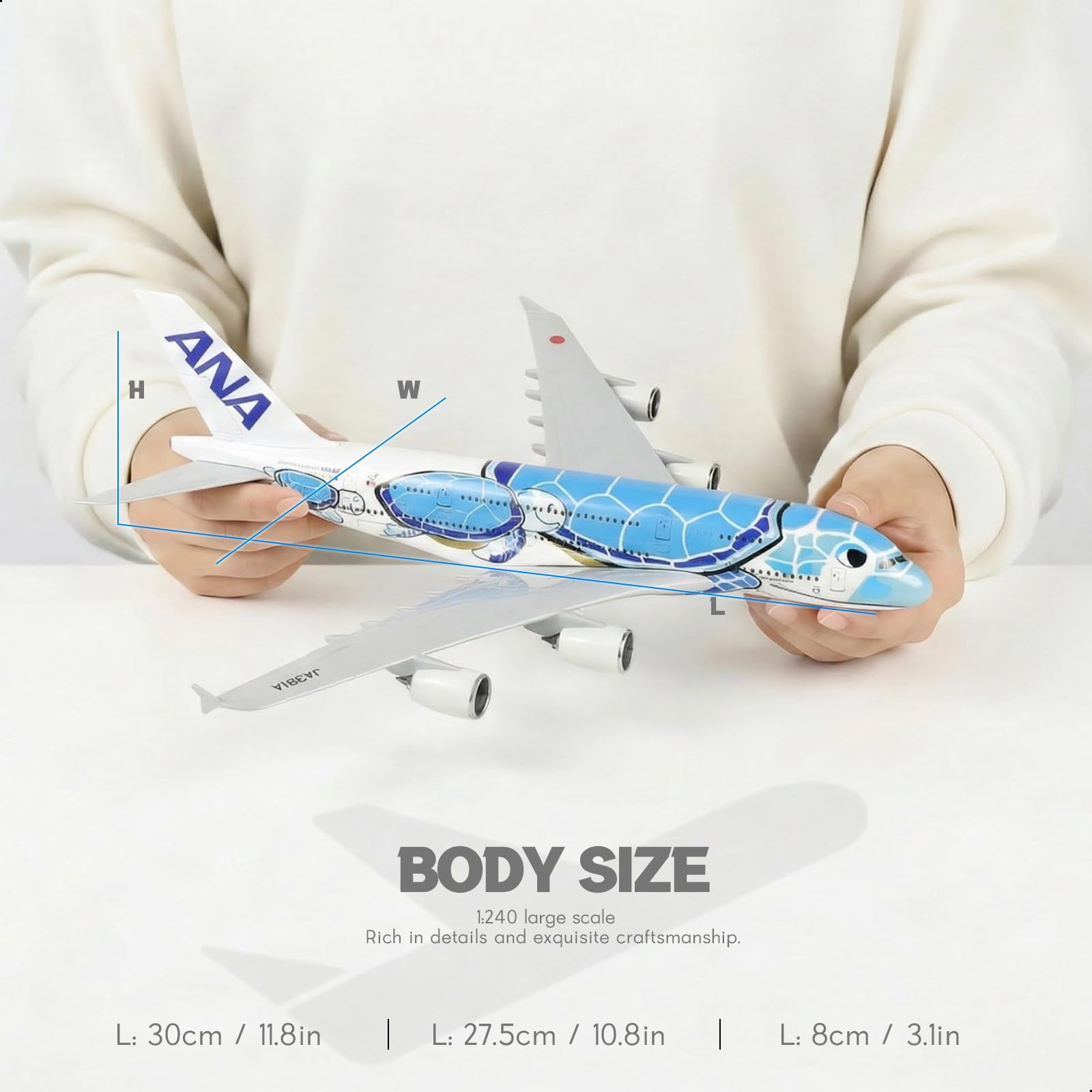 QIYUMOKE 1/240 ANA 'Flying Honu' blue turtle aircraft model, held in hand