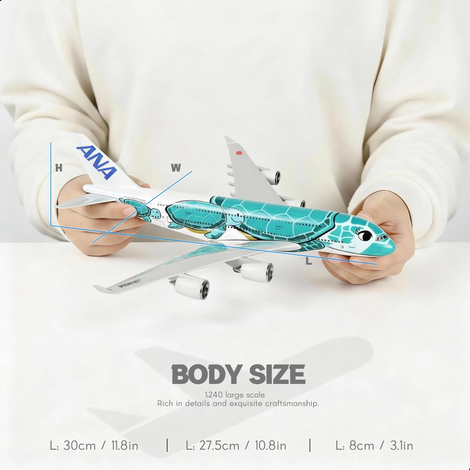 QIYUMOKE 1/240 ANA 'Flying Honu' blue turtle aircraft model held in hands, showcasing size and detail