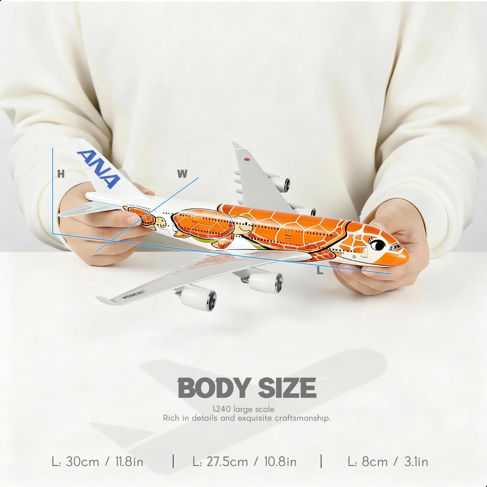 QIYUMOKE 1/240 ANA 'Flying Honu' blue turtle aircraft model held in hands