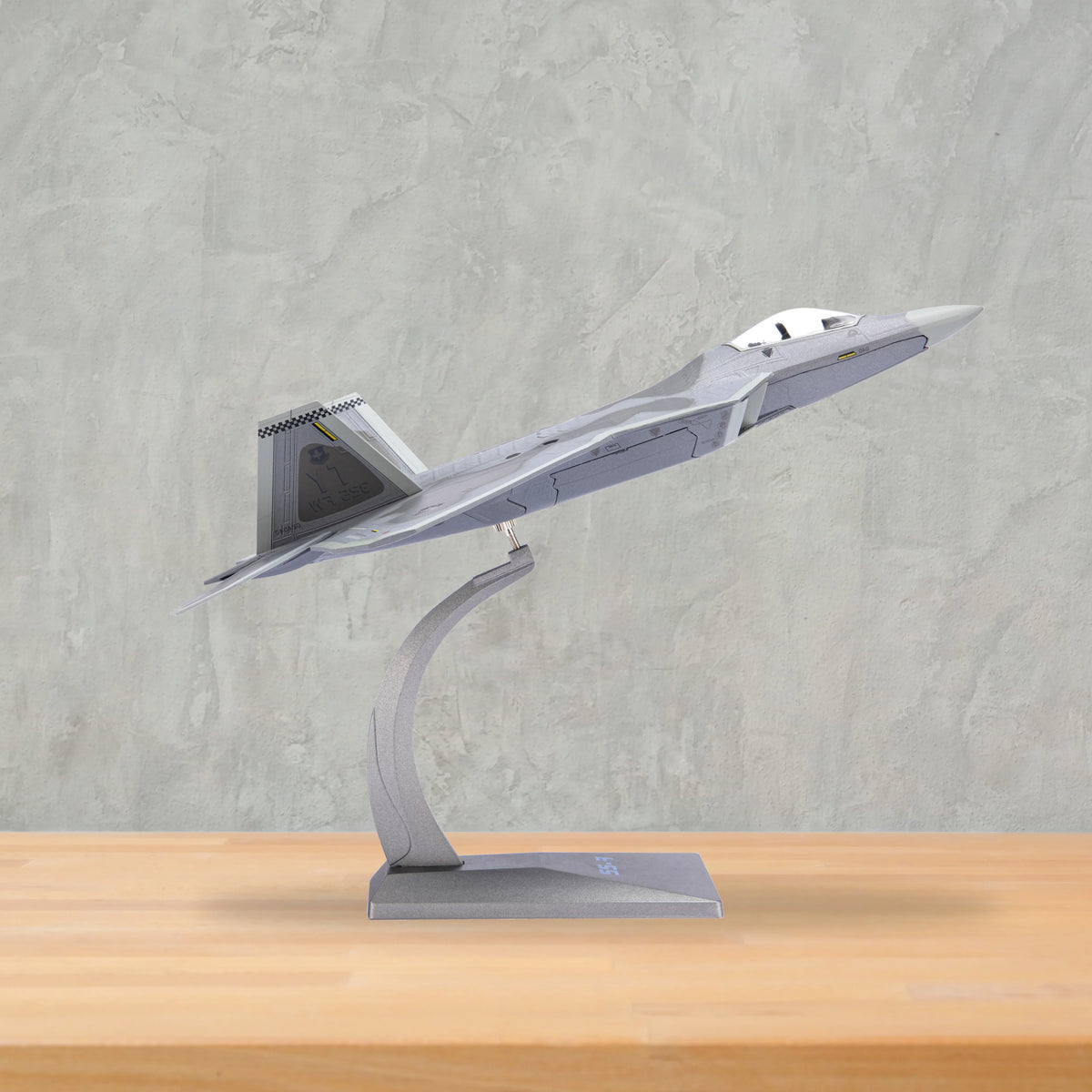 NUOTIE F-22 Raptor model in gray, side profile view, aircraft on display stand
