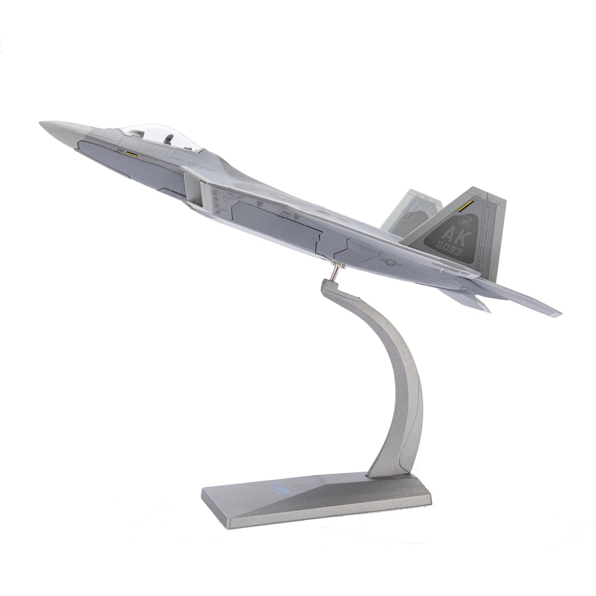 NUOTIE F-22 Raptor diecast model in gray, displayed on a stand, side profile