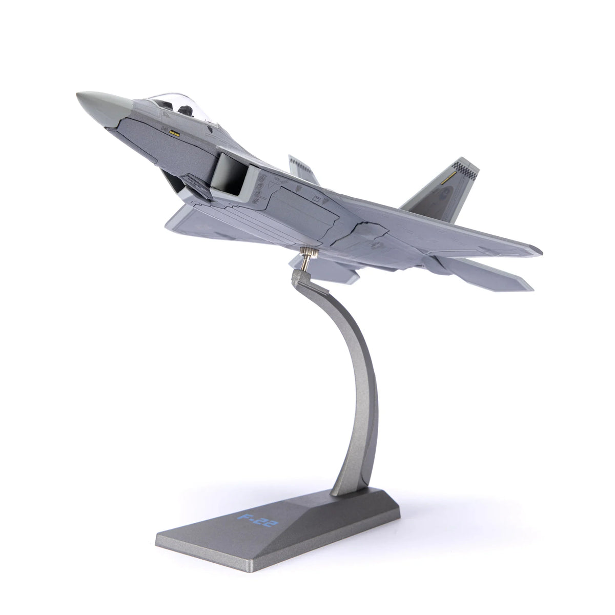 NUOTIE F-22 Raptor diecast model in gray, displayed on a stand, angled view